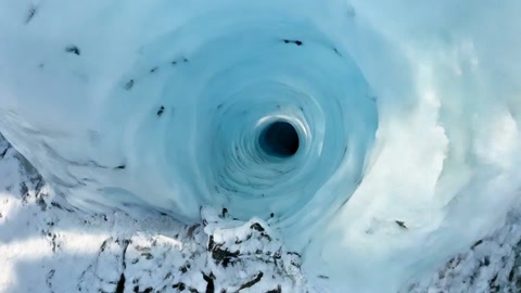 fpv racing drone fly-through in a glacial canyon