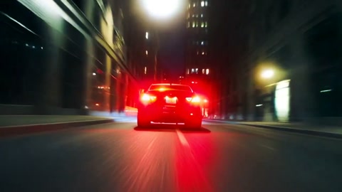 Rear Tracking Shot Sedan City Street Night